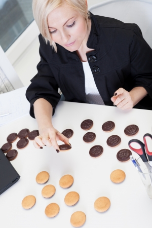 Business woman playing anti-diet gameの写真素材