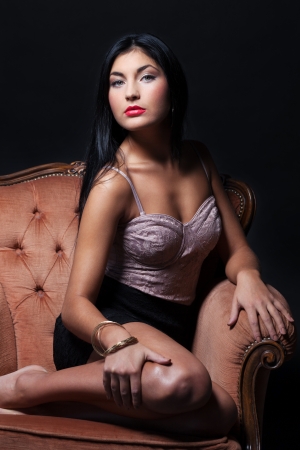 Gorgeous beauty on a luxury armchairの写真素材