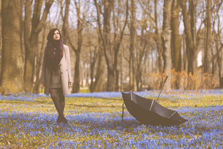 Beautiful girl enjoys spring time in the parkの写真素材