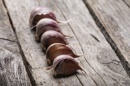 Garlic on the vintage wooden tableの写真素材