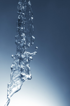 Speed photo of blue water falling from the topの写真素材