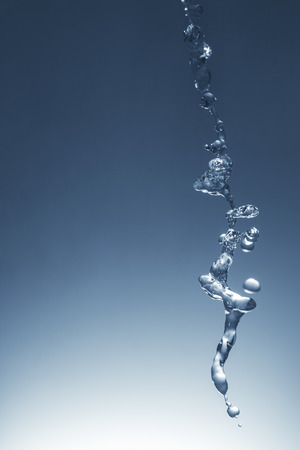 Speed photo of blue water falling from the topの写真素材
