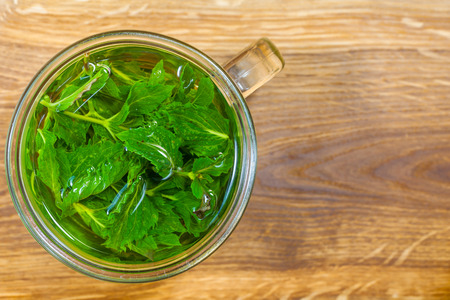 Freshly made mint tea on the wooden table