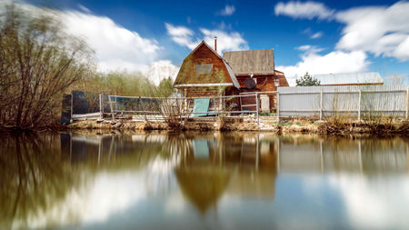 village house near the reflecting poolの写真素材