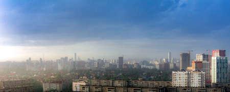 Dawn clouds over the metropolis of early sunset