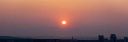 Sunset over the hills in clear weather gorizon cloudsの写真素材