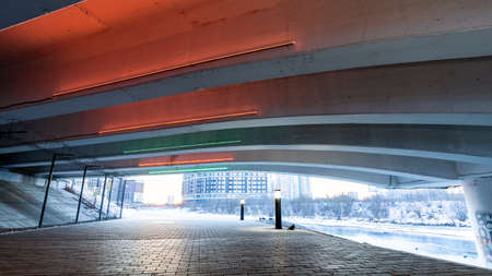 space under the bridge with artificial lighting