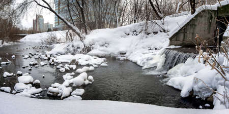 snow-covered river in winter snow