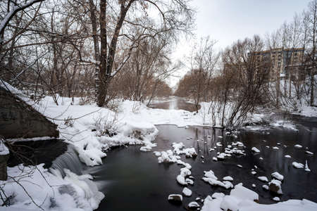 snow-covered river in winter snow