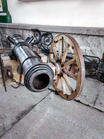 antique cannon on a wooden carriageの写真素材