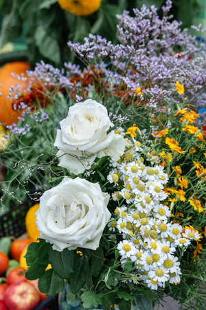 autumn bouquet of roses and daisiesの写真素材
