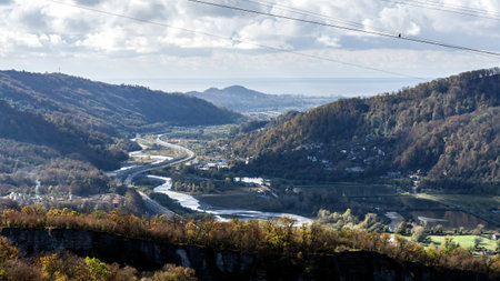 view of the valley of the Mzymta river with built structures in Adler