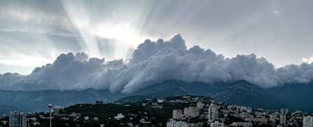 view of the Yalta mountain range with hanging storm clouds along the frontの写真素材