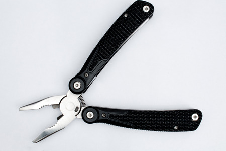 multitool close-up shot on white backgroundの写真素材