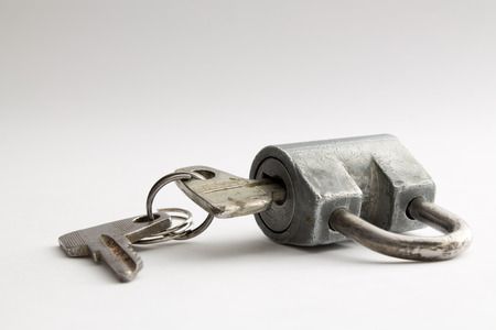 padlock with keys isolated on a white background