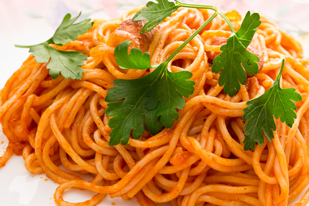 noodles in tomato sauce with parsleyの写真素材