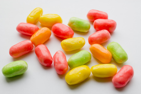 colored candy on white background closeupの写真素材