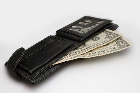 dollars in wallet on white background