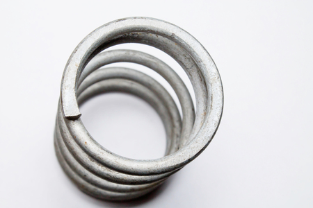 coil spring on white backgroundの写真素材