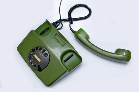 old green telephone on white backgroundの写真素材