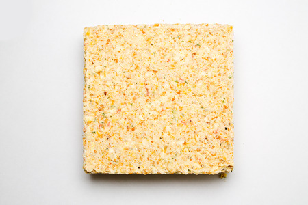 briquette of pea soup on white background
