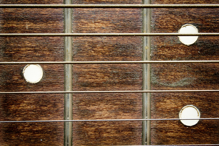 Fragment of an acoustic guitar - closeup shotの写真素材