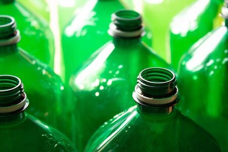 Green plastic bottles close up