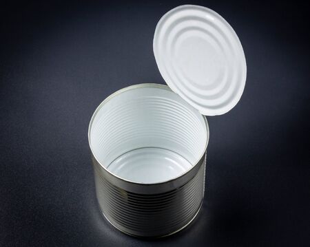 Empty tin can close up on a black background