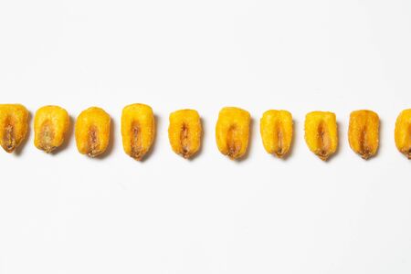 Roasted corn nuts on white background