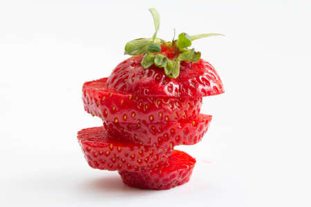 Sliced strawberry on white backgroundの写真素材