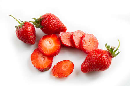 Sliced strawberries on white backgroundの写真素材