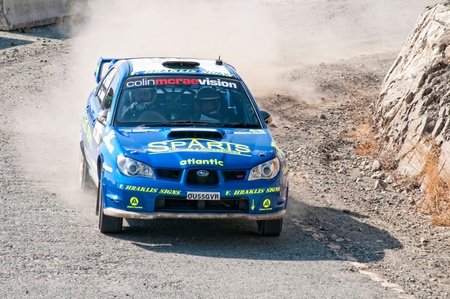 LIMASSOL, CYPRUS - NOVEMBER 7: Driver Yiangou Yiangos and co-driver Christophi Leonidas driving Subaru Impreza STi during Rally Cyprus event at Love Cyprus Golden Stage on November 7, 2010 in Limassol, Cyprus. のeditorial素材