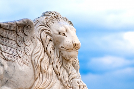 Winged lion head, detail of antique statueの写真素材