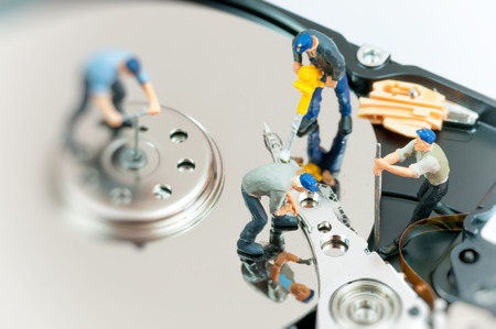 Workers repairing hard drive. の写真素材