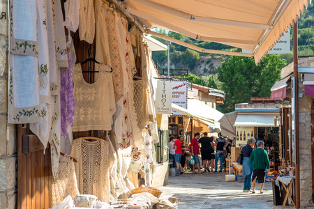 OMODOS, CYPRUS - OCTOBER 4, 2015: Traditional souvenir shops with embroidery lace, on OCTOBER 4 in Omodos village.のeditorial素材