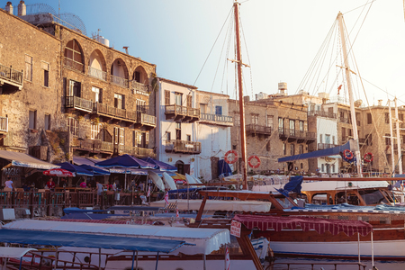 Kyrenia Girne, CYPRUS - JULY 5: Charming harbour filled with yachts and boats at sunset on July 5, 2015. Kyrenia harbor is currently a famous tourist resort.のeditorial素材