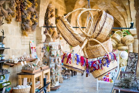 NICOSIA, CYPRUS - AUGUST 10, 2015: Straw basket souvenirs at Buyuk Han The Great Inn.のeditorial素材