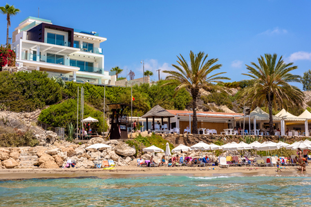 PAPHOS, CYPRUS - JULY 24, 2016: Coral Bay Beach, one of the best sandy beaches of the region.のeditorial素材