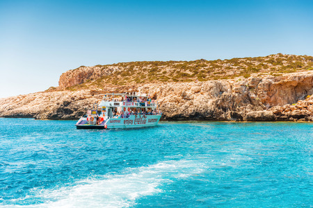 AYIA NAPA, CYPRUS - JULY 16, 2016: Recreational boat with tourists in the waters of the Mediterranean.のeditorial素材