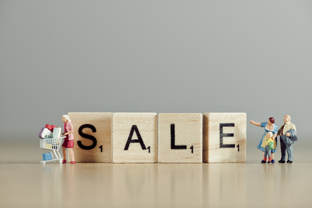 Word 'sale' spelled out with wooden tiles.の写真素材