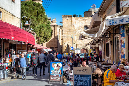 NICOSIA, CYPRUS - DECEMBER 03, 2015: Cafes and restaurants at Arasta street, a touristic street leading to an Selimiye mosque.のeditorial素材