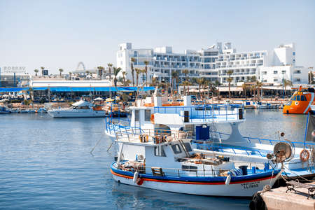 AYIA NAPA, CYPRUS - August 10, 2019: View of harbor surrounded by numerous cafes and restaurantsのeditorial素材