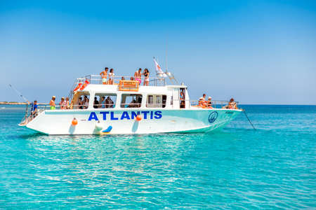 AYIA NAPA, CYPRUS - July 23, 2018: Excursion boat full of tourists at Famagusta Bay
