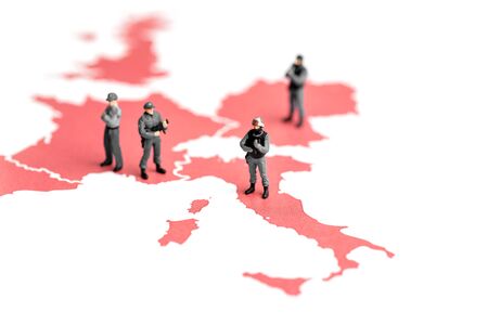 Miniature police on top of map of europe