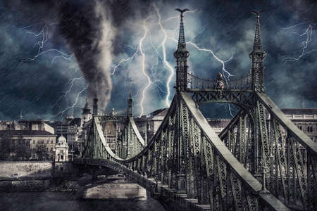 Apocalyptic Budapest cityscape with tornado, heavy rain and lighting. Digital illustrationの素材 [FY310157377047]