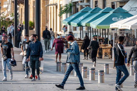 Nicosia, Cyprus - November 07, 2020: Man in protective medical mask walking on Eleftheria Square during Covid 19 pandemicのeditorial素材