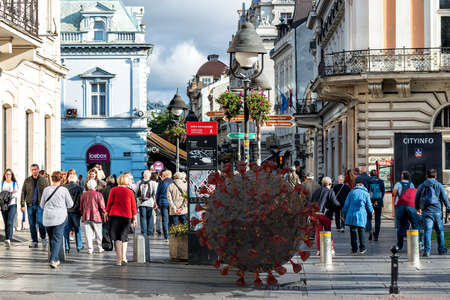 Belgrade, Serbia - March 13, 2020: Virus molecule in a crowd of people. Pandemic concept. Illustrative Editorialのeditorial素材