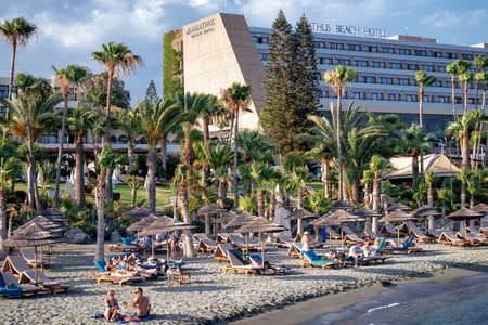 Limassol, Cyprus - June 24, 2019: People relaxing on the city beach near famous Amathus hotelのeditorial素材