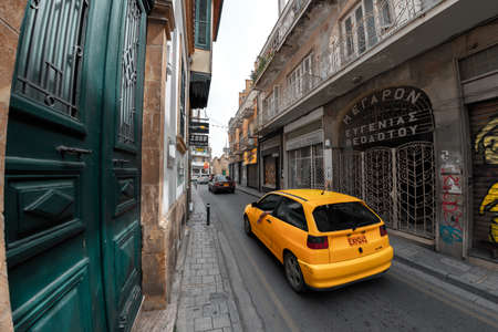 Nicosia, Cyprus - April 14, 2019: Car passing narrow street in old town of Nicosiaのeditorial素材