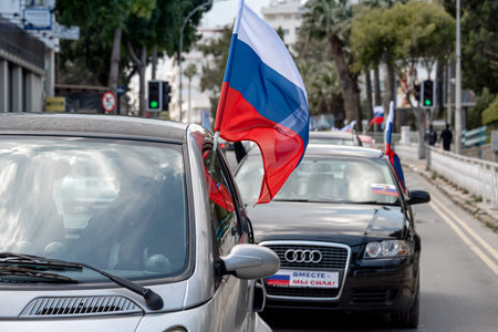 Larnaca, Cyprus - March 26, 2022: Cars with flags of Russia during Pro-Russian Rally at Foinikoudes area in Larnacaのeditorial素材